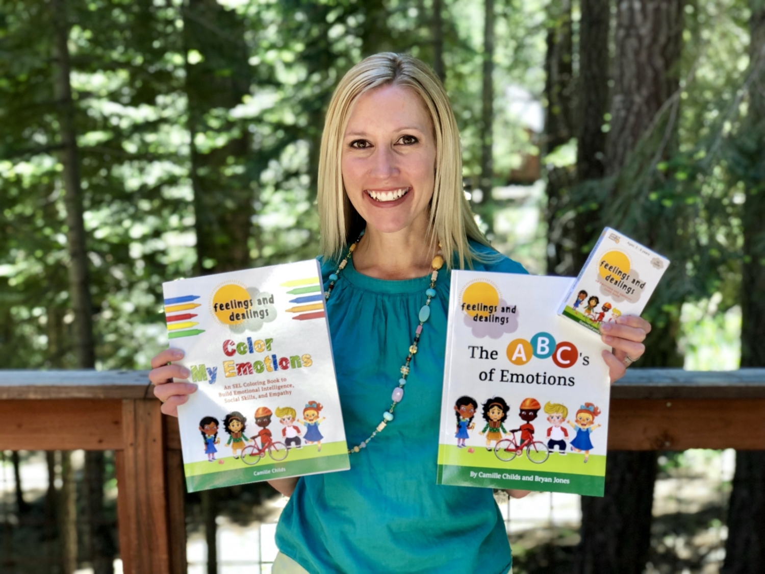 Author Camille Childs with Game On Family's Social Emotional Learning Books and Games